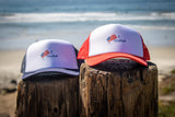 I Surfed I Dolfed Trucker hats at the beach